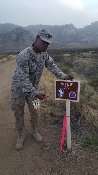 U.S. Air Force Capt. Ro’Maine Pryor, a logistics officer assigned to the 97th Logistics Readiness Squadron, stops at the 25-mile marker during the 29th annual Bataan Memorial Death March, March 25, 2018, at White Sands, N.M.