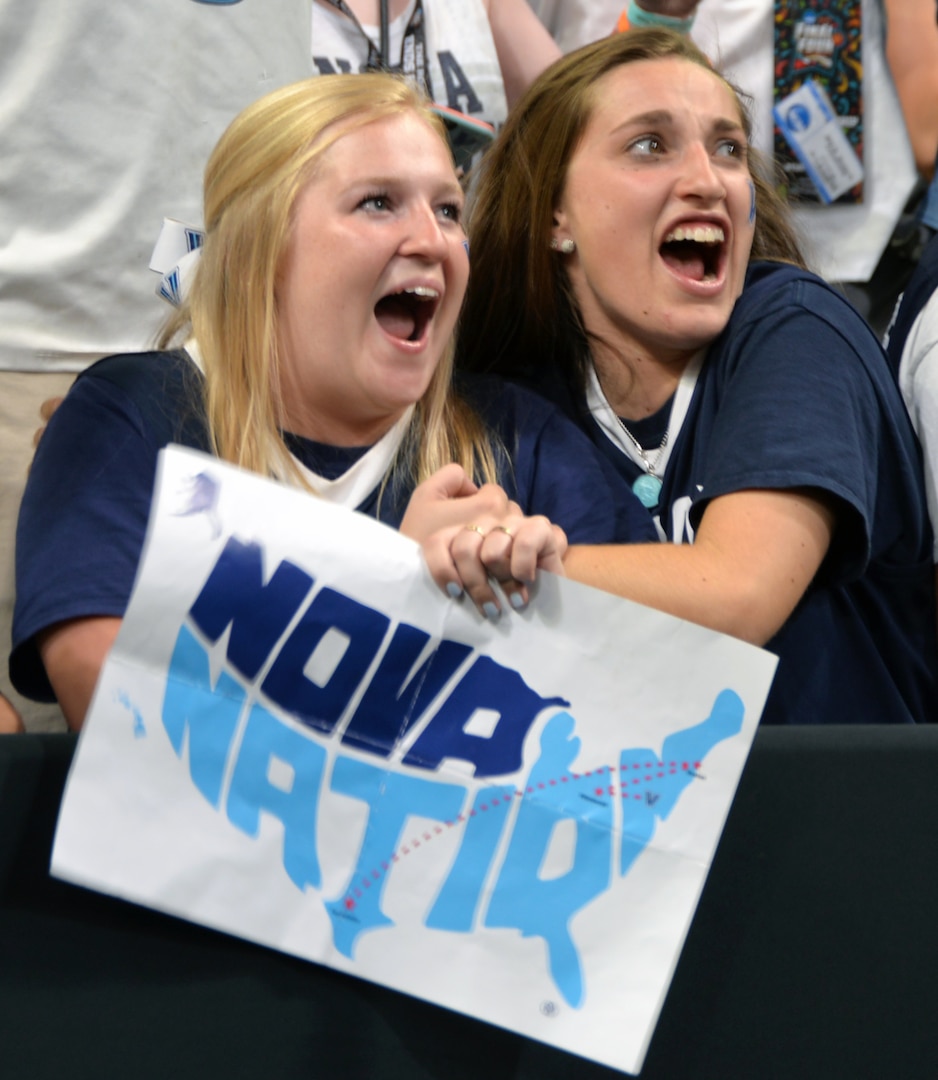 A pair of Villanova fans get ready to celebrate the Wildcats' victory at the NCAA Division I men's basketball championship game at the Alamodome Monday, April 2, 2018.