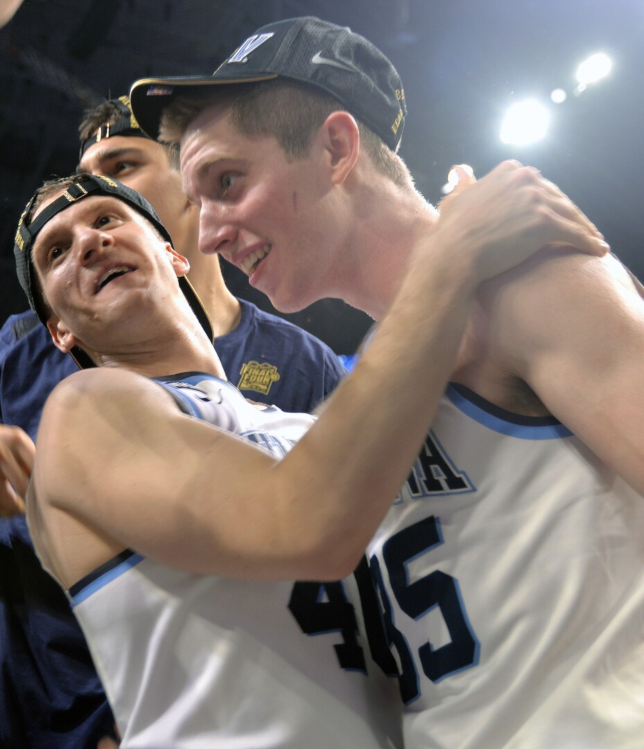 A pair of Villanova Wildcats players celebrate their team's victory at the NCAA Division I men's basketball championship game at the Alamodome Monday, April 2, 2018.
