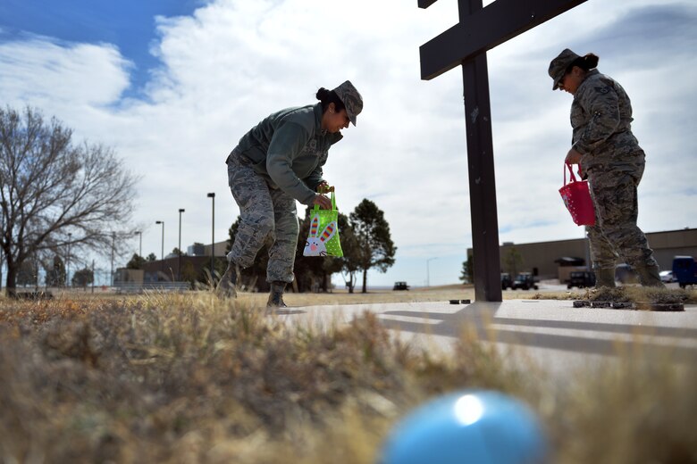 Airmen participate in the 50th Space Wing Chaplains Office Easter Egg Hunt, at Schriever Air Force Base, Colorado, April 2, 2018. The event allowed members to hunt for eggs filled with candy and a chance to win prizes all while enjoying a free lunch. (U.S. Air Force photo by Dennis Rogers)
