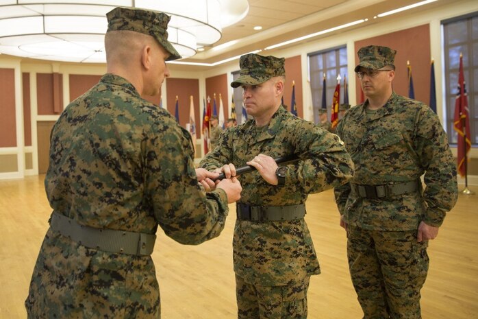 U.S. Marine Corps Sgt. Maj. Christopher Garza, sergeant major with the 24th Marine Expeditionary Unit (MEU) receives the noncommissioned sword from Col. Eric Cloutier, commanding officer, 24th MEU during a relief and appointment ceremony aboard Camp Lejeune, (U.S. Marine Corps photo by Cpl. Hernan Vidaña)