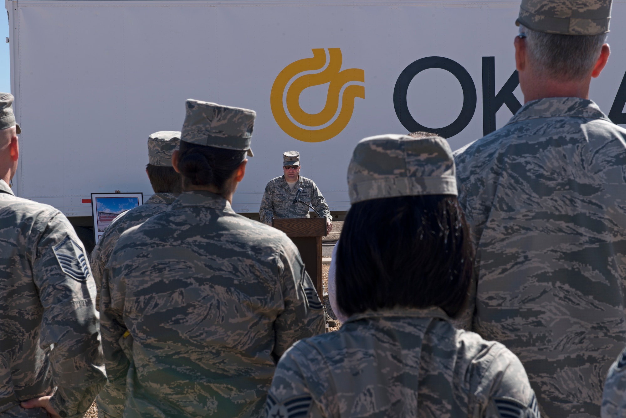 Maj. Nathaniel Edwards, 56th Communications Squadron commander, addresses the crowd during the groundbreaking ceremony for the squadron’s future operations building at Luke Air Force Base, Ariz., March 28, 2018. The building will improve internal communications by moving the squadron into one centralized location. (U.S. Air Force photo by Senior Airman Ridge Shan)