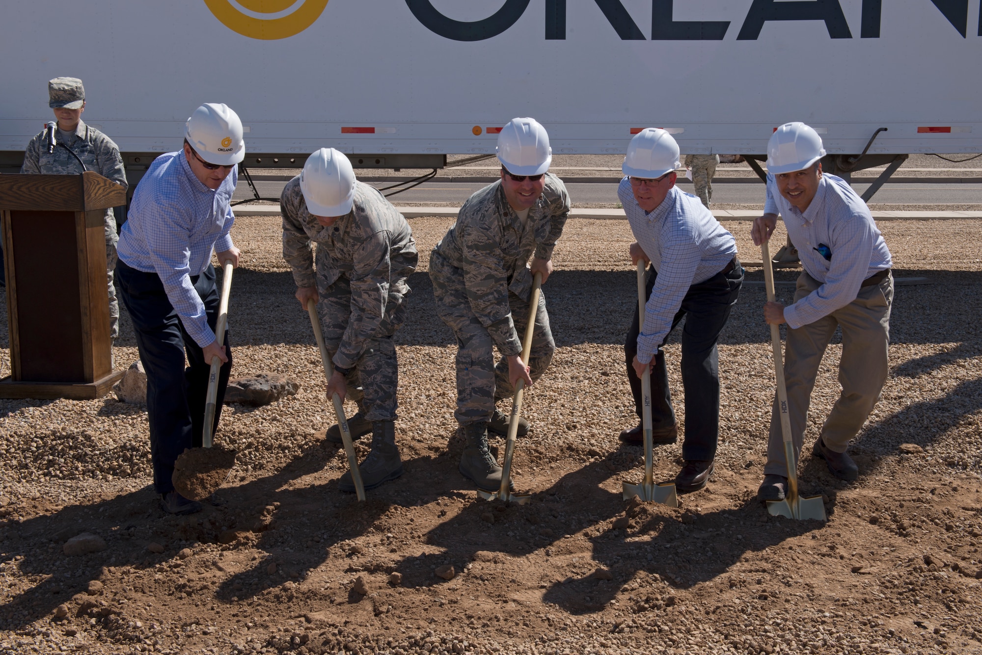 Representatives from the partners in the construction of the 56th Communications Squadron’s future operations building dig the first holes during the building’s groundbreaking ceremony at Luke Air Force Base, Ariz., March 28, 2018. The partners include the 56th CS, the 56th Civil Engineer Squadron, the Army Corps of Engineers, and private contractors. (U.S. Air Force photo by Senior Airman Ridge Shan)