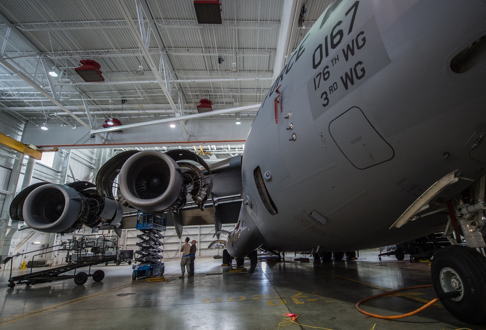 A C-17 Globemaster III assigned to the 176th Wing sits inside a hangar for a home station check at Joint Base Elmendorf-Richardson, Alaska, March 27, 2018. The 3rd and 176th maintenance squadrons complete an in-depth, four-day scheduled inspection of a C-17 approximately every 180 days. A home station check is the behind-the-scenes maintenance that can prevent loss of life, lead to savings in time and money and keep the aircraft fit to fight.