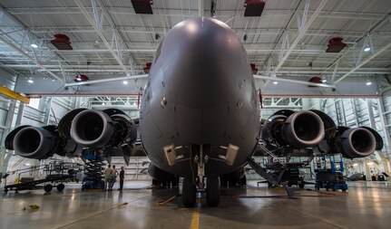 A C-17 Globemaster III assigned to the 176th Wing sits inside a hangar for a home station check at Joint Base Elmendorf-Richardson, Alaska, March 27, 2018. The 3rd and 176th maintenance squadrons complete an in-depth, four-day scheduled inspection of a C-17 approximately every 180 days. A home station check is the behind-the-scenes maintenance that can prevent loss of life, lead to savings in time and money and keep the aircraft fit to fight.