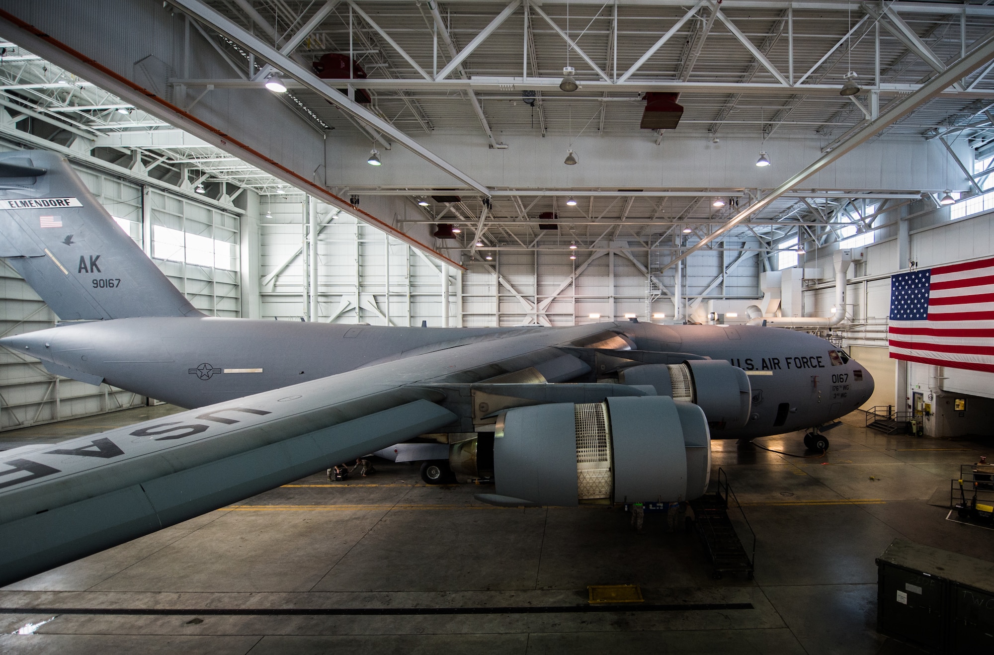 A C-17 Globemaster III assigned to the 176th Wing sits inside a hangar for a home station check at Joint Base Elmendorf-Richardson, Alaska, March 27, 2018. The 3rd and 176th maintenance squadrons complete an in-depth, four-day scheduled inspection of a C-17 approximately every 180 days. A home station check is the behind-the-scenes maintenance that can prevent loss of life, lead to savings in time and money and keep the aircraft fit to fight.