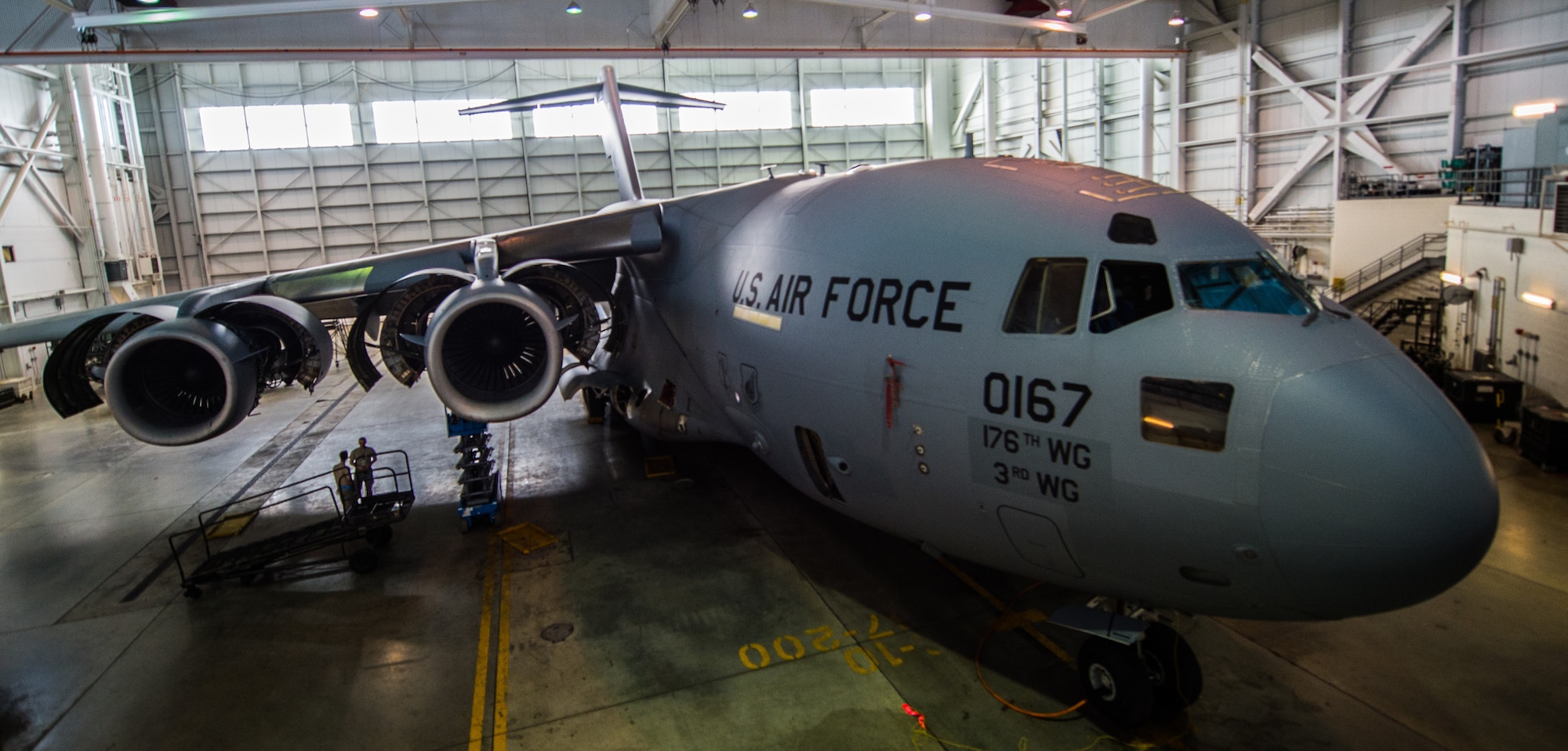 A C-17 Globemaster III assigned to the 176th Wing sits inside a hangar for a home station check at Joint Base Elmendorf-Richardson, Alaska, March 27, 2018. The 3rd and 176th maintenance squadrons complete an in-depth, four-day scheduled inspection of a C-17 approximately every 180 days. A home station check is the behind-the-scenes maintenance that can prevent loss of life, lead to savings in time and money and keep the aircraft fit to fight.