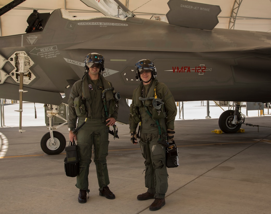 The Commanding Officer of Marine Fighter Attack Squadron 122 (VMFA-122), Lt. Col. John P. Price, and Maintenance Officer of VMFA-122, Maj. Christopher J. Kelly pose for a photo after conducting VMFA-122's first flight operations in an F-35B Lightning ll at Marine Corps Air Station (MCAS) Yuma, Ariz., March 29, 2018. VMFA-122 conducted the flight operations for the first time as an F-35 squadron. (U.S. Marine Corps photo by Lance Cpl. Sabrina Candiaflores)