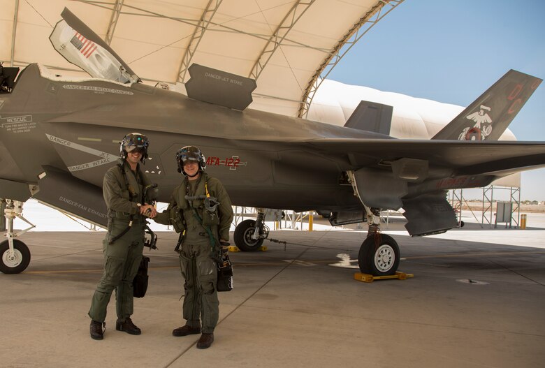 The Commanding Officer of Marine Fighter Attack Squadron 122 (VMFA-122), Lt. Col. John P. Price, and Maintenance Officer of VMFA-122, Maj. Christopher J. Kelly pose for a photo after conducting VMFA-122's first flight operations in an F-35B Lightning ll at Marine Corps Air Station (MCAS) Yuma, Ariz., March 29, 2018. VMFA-122 conducted the flight operations for the first time as an F-35 squadron. (U.S. Marine Corps photo by Lance Cpl. Sabrina Candiaflores)