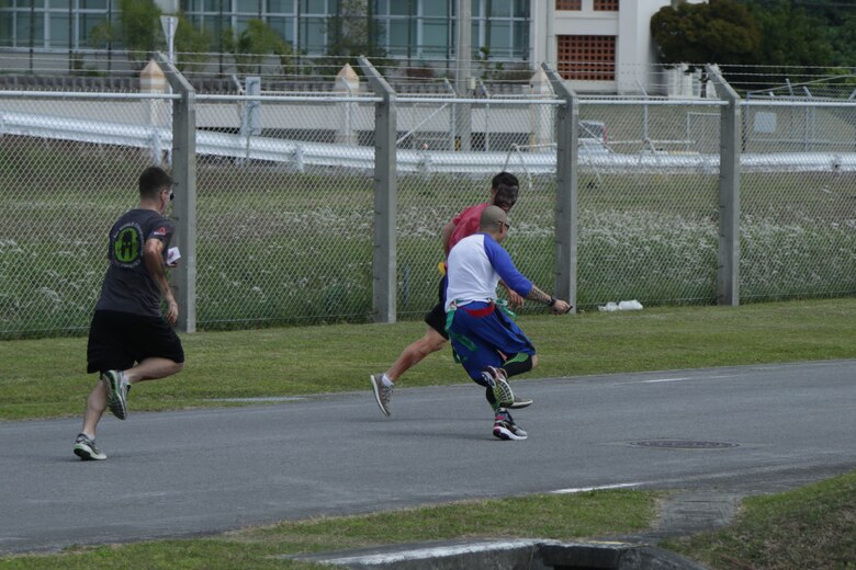 CAMP LESTER, OKINAWA, Japan – A runner evades two zombies during the American Red Cross hosted Zombie Run March 31 aboard Camp Lester, Okinawa, Japan.
