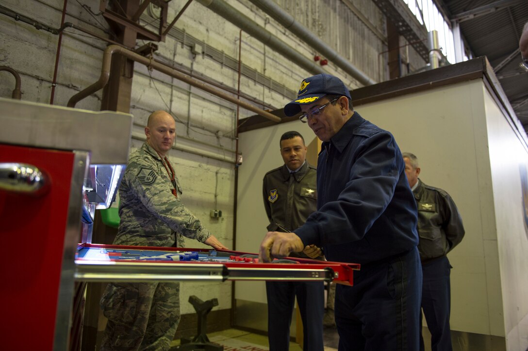 Maj. Gen. Hassan Fakri, Royal Moroccan Air Force deputy inspector, examines an automated toolbox during a tour of Hangar 1 at Spangdahlem Air Base, Germany, March 28, 2018. The visit marked the first time the RMAF has visited the 52nd Fighter Wing, allowing for reinforcement in bilateral relationship as well as a means to identify future security cooperation priorities between the USAF and RMAF. (U.S. Air Force photo by Senior Airman Dawn M. Weber)
