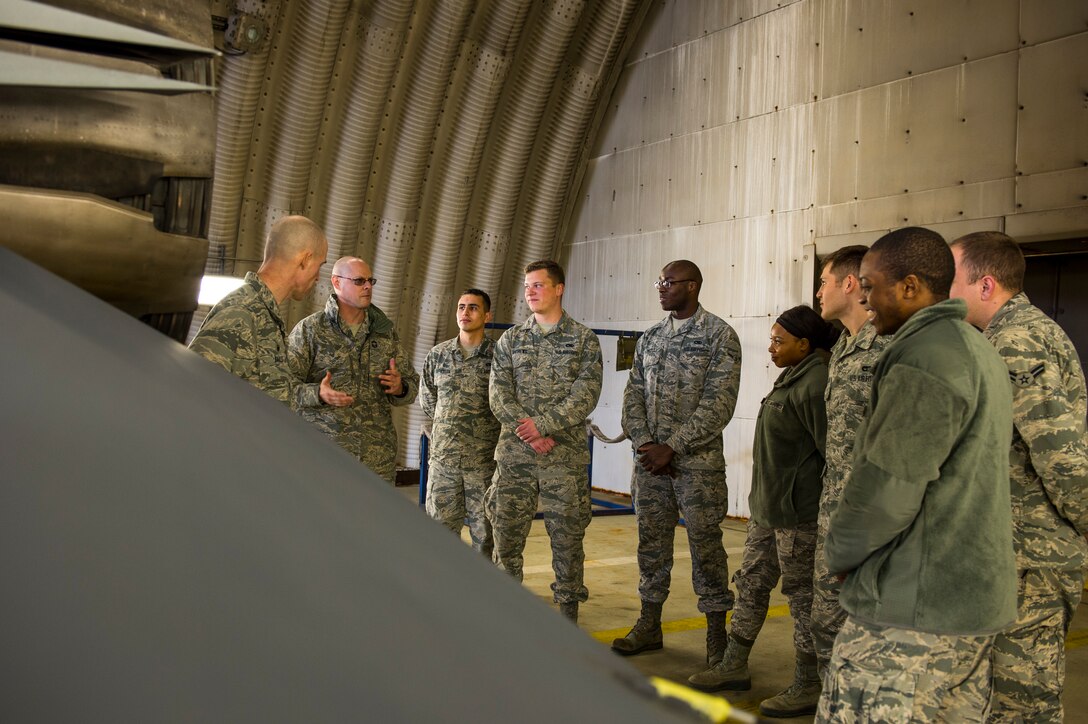 U.S. Air Force Chief Master Sgt. Christopher Vansile, 52nd Fighter Wing acting command chief, talks about getting to experience an incentive flight in a fighter aircraft as a young Airman, at Spangdahlem Air Base, Germany, April 4, 2018. The tour gave Col. Jason Bailey, 52nd FW commander, and Vansile a chance to meet Airmen from around the base who don’t normally work flightline operations. (U.S. Air Force photo by Senior Airman Dawn M. Weber)