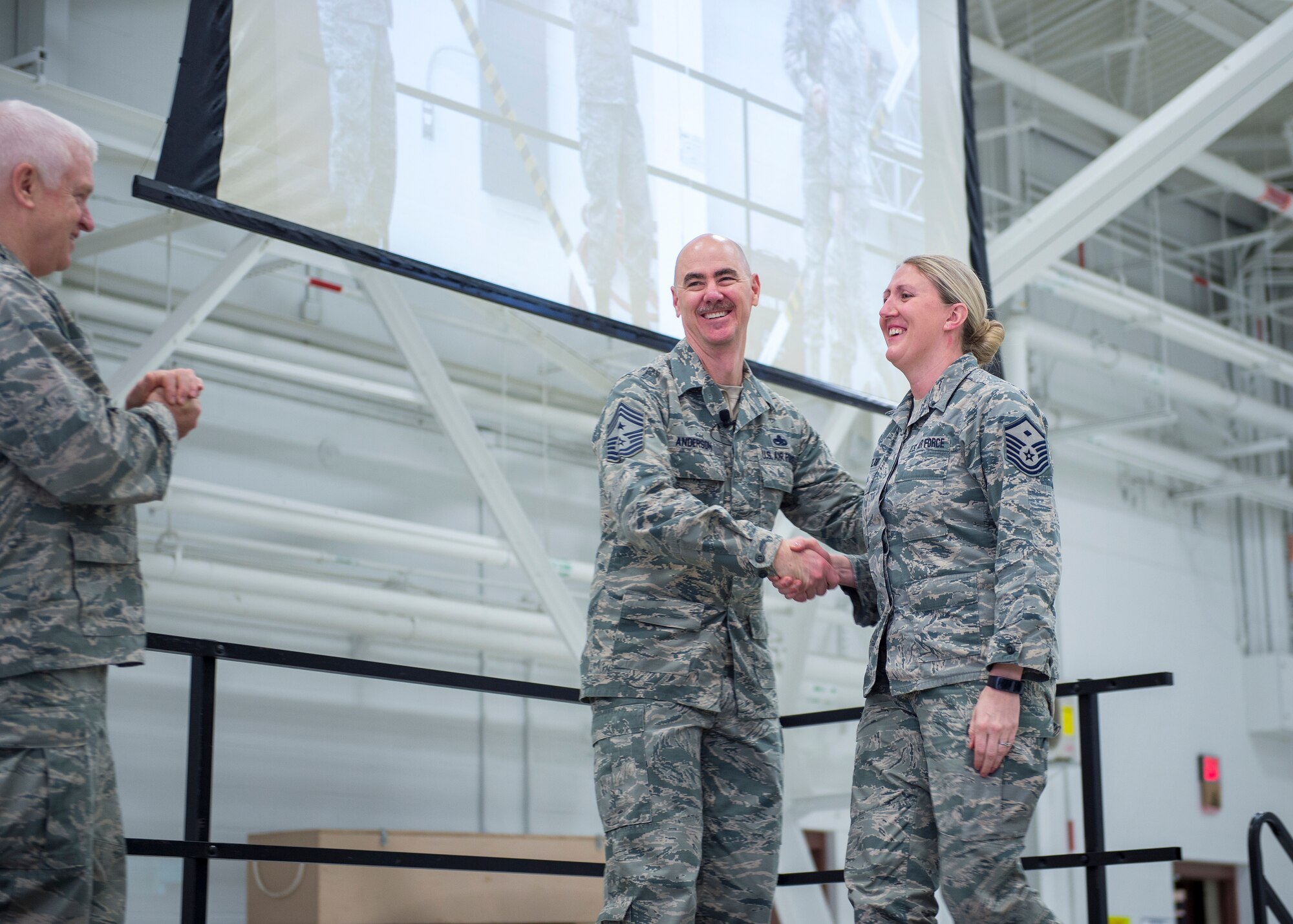 U.S. Air Force Master Sgt. Nicole Martland, first sergeant with the 133rd Civil Engineer Squadron, is recognized and coined for going above and beyond in maintaining contact with deployed airmen and their families in St. Paul, Minn., March 25, 2018.