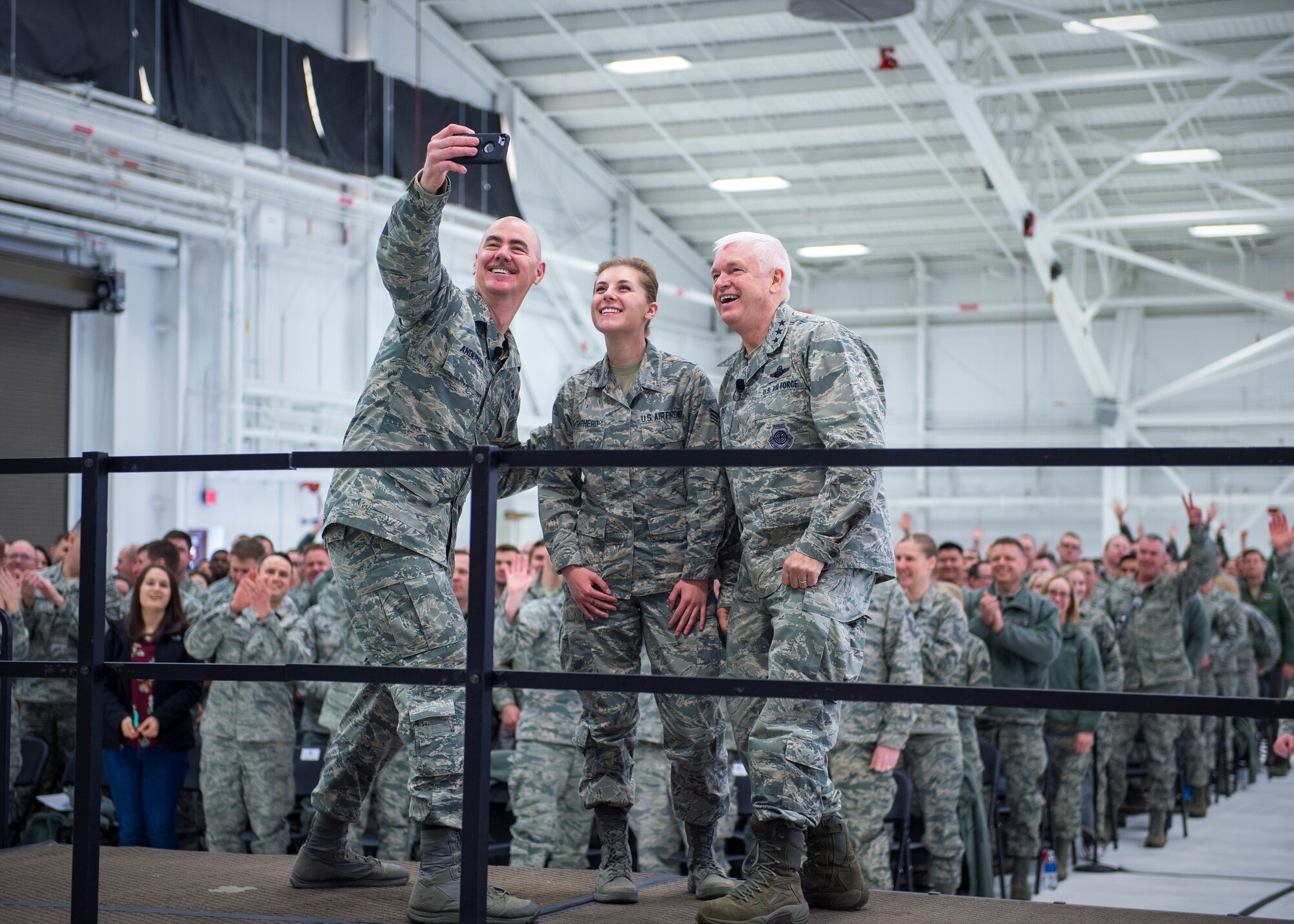 U.S. Air Force Senior Airman Paige Shepherd, 133rd Medical Group, takes a photo with Lt. Gen. L. Scott Rice, right, director, Air National Guard, and Chief Master Sgt. Ronald Anderson, left, Command Chief of the Air National Guard in St. Paul, Minn., March 25, 2018.