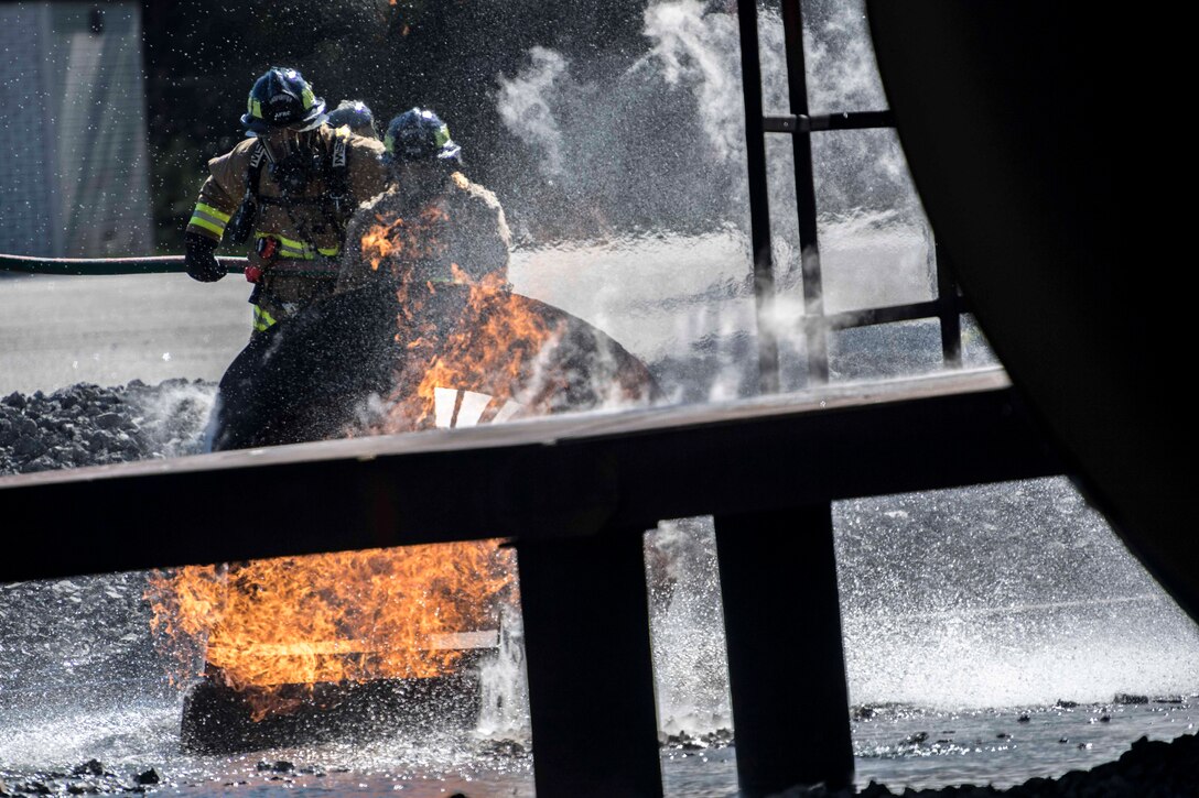 Reserve Firefighters Tackle the Aircraft Burn Trainer