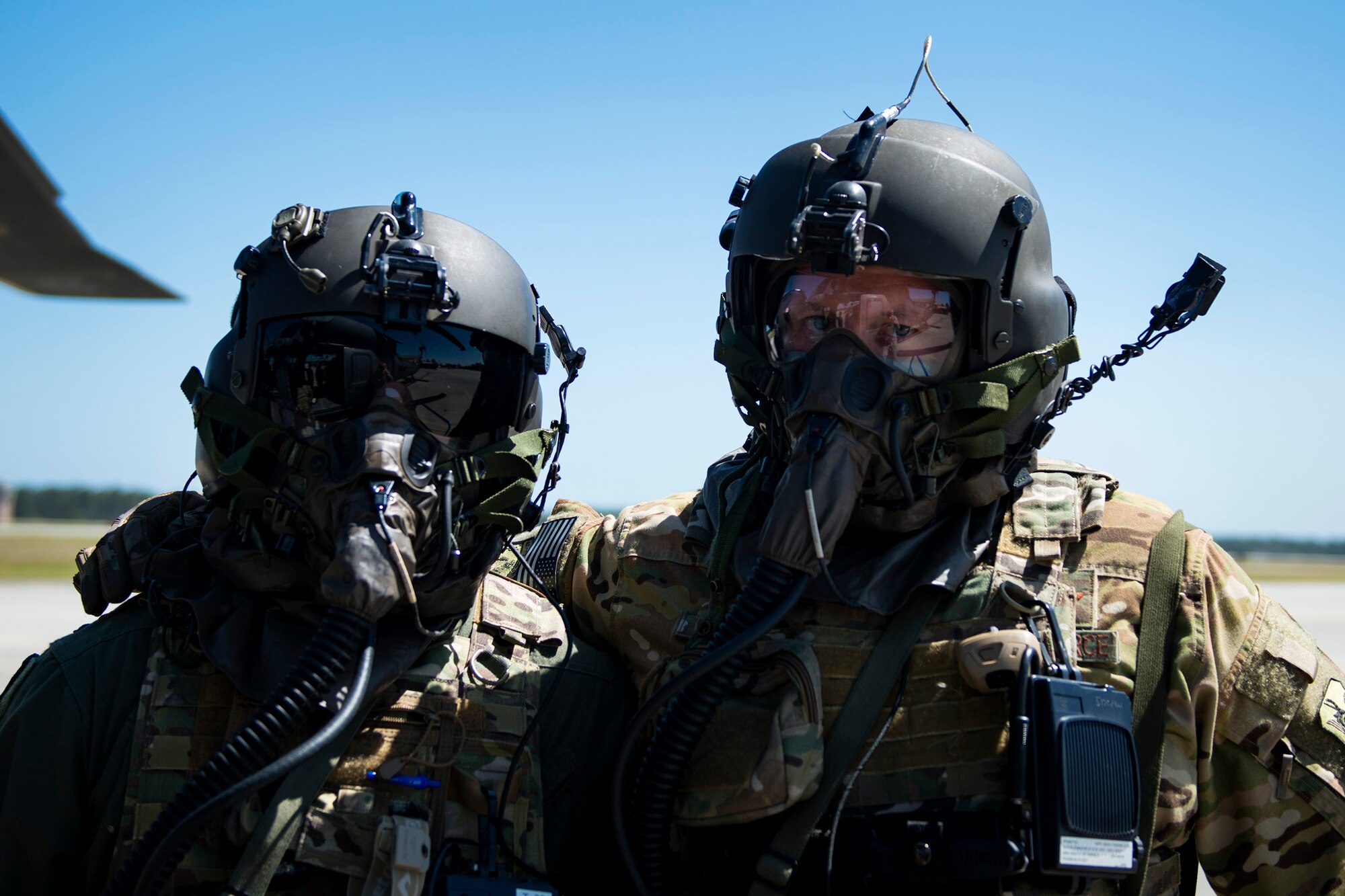 HH-60G Pave Hawk crew members from the 41st Rescue Squadron pose for a photo during a chemical, biological, radiological and nuclear exercise, March 28, 2017, at Moody Air Force Base, Ga. The Airmen were geared up in mission-oriented protective posture (MOPP) gear to simulate potential conditions they could face while deployed in austere environments. While in MOPP gear, Airmen have to deal with claustrophobic conditions, impaired communication and battle the constant threat of heat exhaustion, while completing the mission. (U.S. Air Force photo by Airman 1st Class Erick Requadt)
