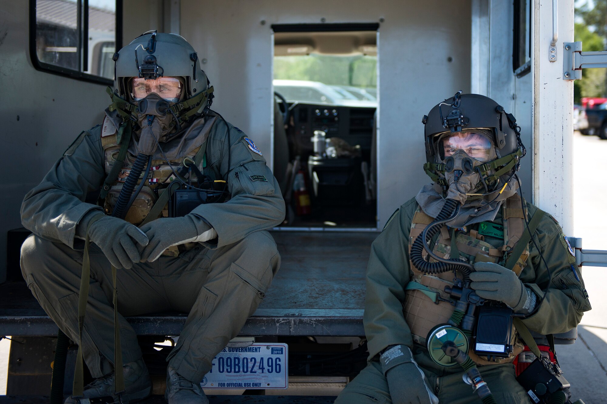 HH-60G Pave Hawk crew members from the 41st Rescue Squadron wait to be taken to an aircrew contamination control area during a chemical, biological, radiological and nuclear exercise, March 28, 2017, at Moody Air Force Base, Ga. The Airmen were geared up in mission-oriented protective posture (MOPP) gear to simulate potential conditions they could face while deployed in austere environments. While in MOPP gear, Airmen have to deal with claustrophobic conditions, impaired communication and battle the constant threat of heat exhaustion, while completing the mission. (U.S. Air Force photo by Airman 1st Class Erick Requadt)