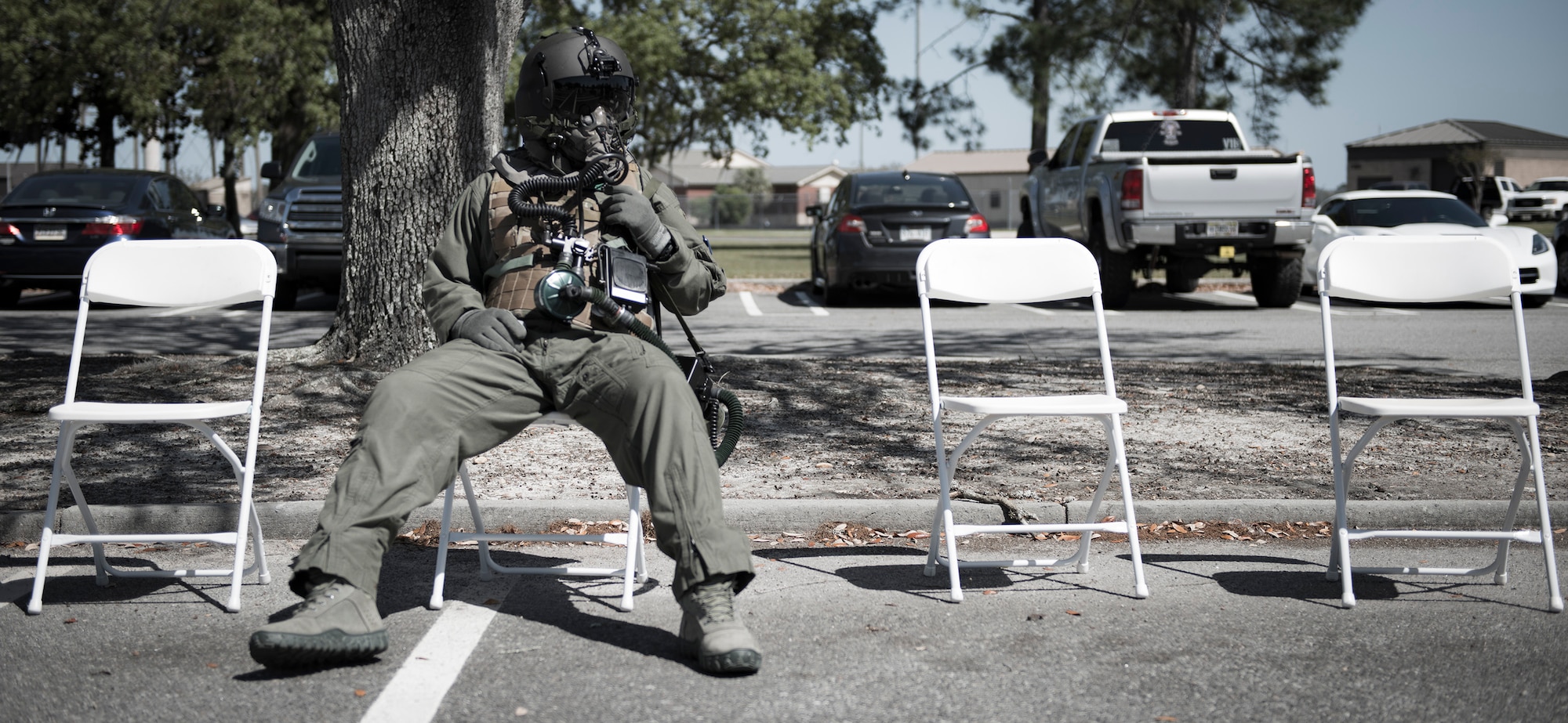 An HH-60G Pave Hawk crew member from the 41st Rescue Squadron waits to go through an aircrew contamination control area during a chemical, biological, radiological and nuclear exercise, March 28, 2017, at Moody Air Force Base, Ga. The Airmen were geared up in mission-oriented protective posture (MOPP) gear to simulate potential conditions they could face while deployed in austere environments. While in MOPP gear, Airmen have to deal with claustrophobic conditions, impaired communication and battle the constant threat of heat exhaustion, while completing the mission. (U.S. Air Force photo by Airman 1st Class Erick Requadt)