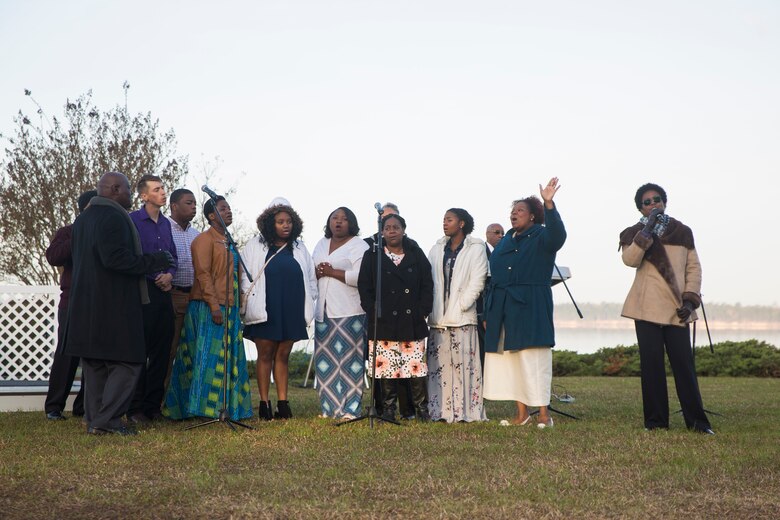 Members of the Tarawa Terrance Chapel priest team sings at the end of the Easter Sunrise Service on Marine Corps Base Camp Lejeune, April 1. The service was held in the morning as the sun rises to symbolize the rise of Christ.