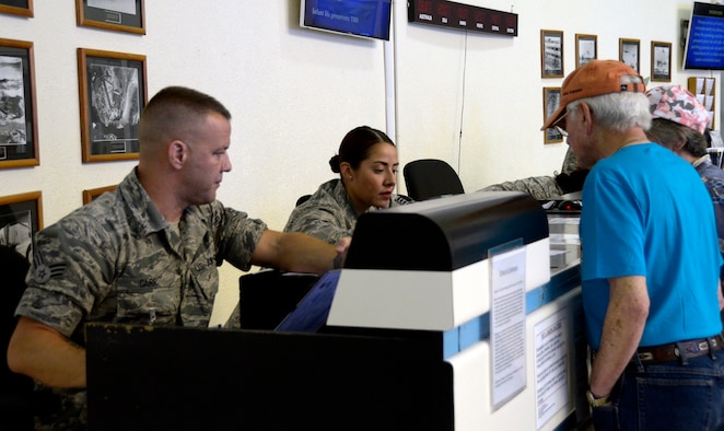 Senior Airman Christian Carr and Staff Sgt. Jennifer Lenz, 87th Aerial Port Squadron, help space-available travelers claim seats on flights at Hickam Air Force Base, Hawaii passenger terminal during annual tour in March 2017. Hickam is a popular location for space-A travelers.