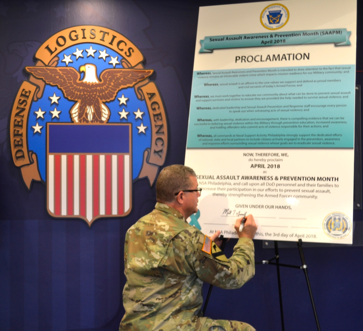DLA Troop Support Commander Army Brig. Gen. Mark Simerly signs the 2018 Sexual Assault Awareness and Prevention Month proclamation April 2 in Philadelphia.