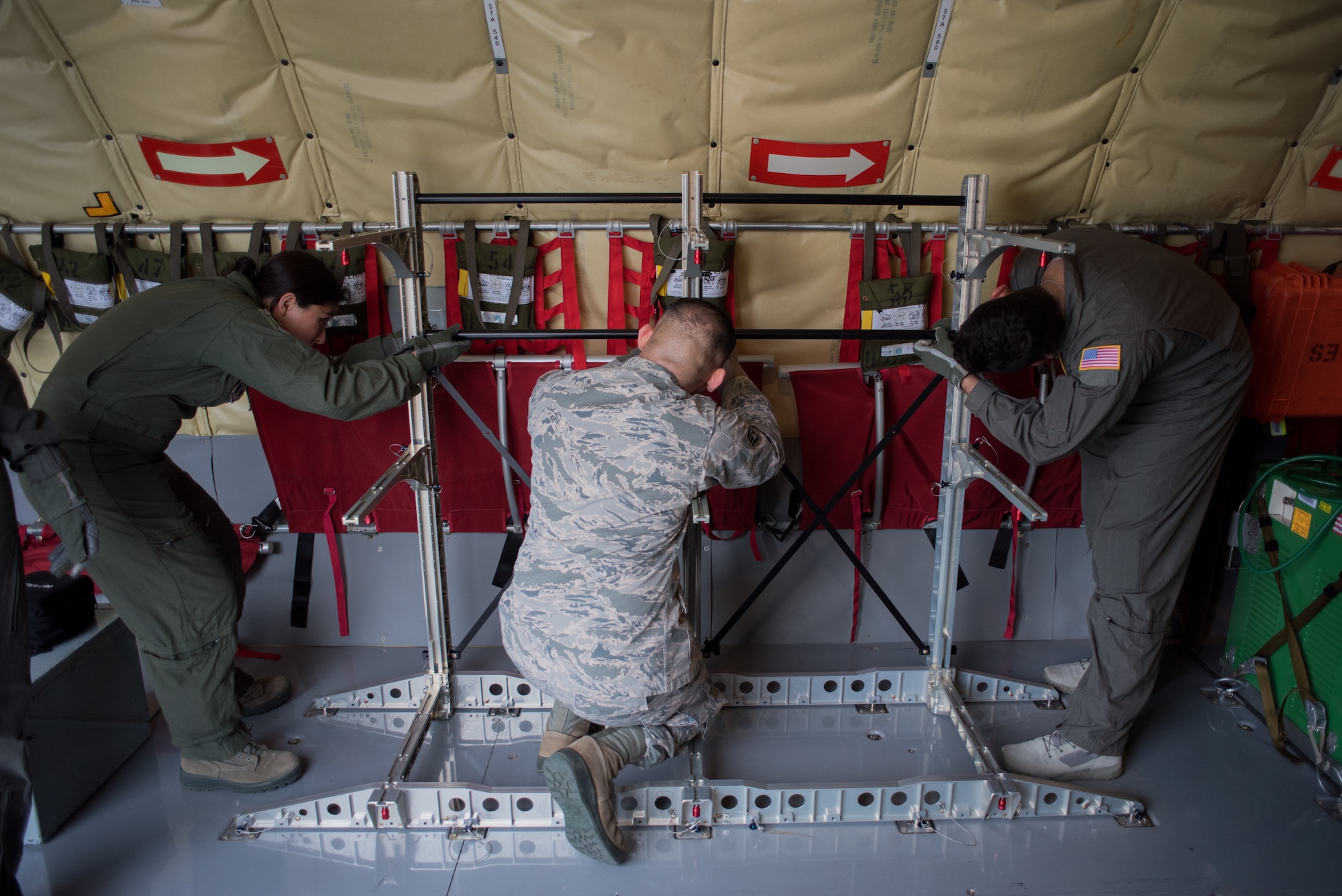 Aeromedical evacuation technicians assemble a stanchion litter system (SLS) before completing in-flight medical scenarios on a 507th Air Refueling Wing KC-135 Stratotanker at Tinker Air Force Base, Oklahoma, March 27, 2018. The flight was a part of MATOP (Multiple Aircraft Training Opportunity Program), a hands-on training program organized by the 137th Aeromedical Evacuation Squadron at Will Rogers Air National Guard Base in Oklahoma City. It was designed to provide aeromedical evacuation squadrons from across the U.S. opportunities to work with the C-130 Hercules, KC-135 Stratotanker and C-17 Globemaster III. The flight brought together aeromedical evacuation units from California, West Virginia, North Carolina, Minnesota, Wyoming, Delaware, Mississippi, New York and Oklahoma.(U.S. Air National Guard photo by Staff Sgt. Tyler Woodward)