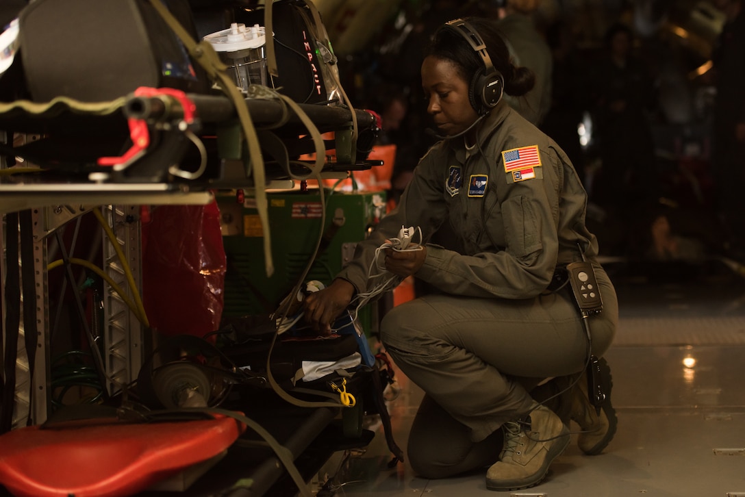 Tech. Sgt. Doretha McLaughlin, an aeromedical evacuation technician from the 156th Aeromedical Evacuation Squadron, North Carolina Air National Guard, secures medical equipment after completing an in-flight scenario on a KC-135 Stratotanker, from the 507th Air Refueling Wing, Tinker Air Force Base, Oklahoma, during MATOP (Multiple Aircraft Training Opportunity Program), March 27, 2018. MATOP was organized by the 137th Aeromedical Evacuation Squadron at Will Rogers Air National Guard Base in Oklahoma City and was designed to give aeromedical evacuation squadrons from across the U.S. a hands-on learning opportunity with the C-130 Hercules, KC-135 Stratotanker and C-17 Globemaster III. The flight brought together aeromedical evacuation units from California, West Virginia, North Carolina, Minnesota, Wyoming, Delaware, Mississippi, New York and Oklahoma. (U.S. Air National Guard photo by Staff Sgt. Tyler Woodward)