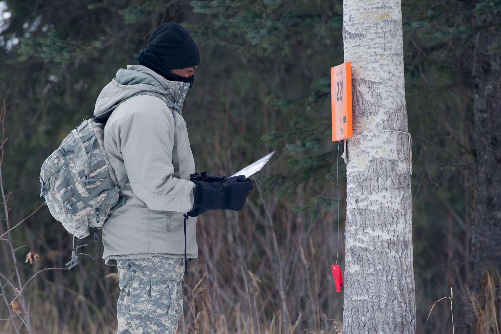 Spc. Nicholas Hayward, assigned to Hawk Company, 3rd Battalion, 509th Parachute Infantry Regiment, 4th Infantry Brigade Combat Team (Airborne), 25th Infantry Division, U.S. Army Alaska, plots his next point during a land navigation course on Joint Base Elmendorf-Richardson, Alaska, April 4, 2018.  Hayward and fellow Soldiers used their skills to plot courses using a lensatic compass, protractor, and a 1:25,000 scale map to navigate to, and locate points using provided grid coordinates within a predetermined time.