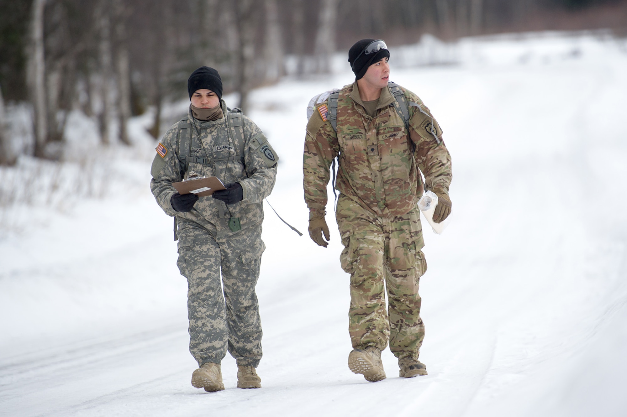 Army Sgt. Gary Santiago,and Spc. Alejandro Barboza, both assigned to Hawk Company,3rd Battalion, 509th Parachute Infantry Regiment, 4th Infantry Brigade Combat Team (Airborne), 25th Infantry Division, U.S. Army Alaska, conduct a land navigation course on Joint Base Elmendorf-Richardson, Alaska, April 4, 2018.  The Soldiers used their skills to plot courses using a lensatic compass, protractor, and a 1:25,000 scale map to navigate to, and locate points using provided grid coordinates within a predetermined time.