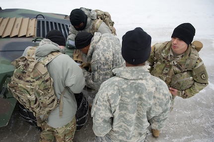 Paratroopers assigned to the 4th Infantry Brigade Combat Team (Airborne), 25th Infantry Division, U.S. Army Alaska, calculate their position on a map while conducting a land navigation course on Joint Base Elmendorf-Richardson, Alaska, April 4, 2018.  The Soldiers used their skills to plot courses using a lensatic compass, protractor, and a 1:25,000 scale map to navigate to, and locate points using provided grid coordinates within a predetermined time.