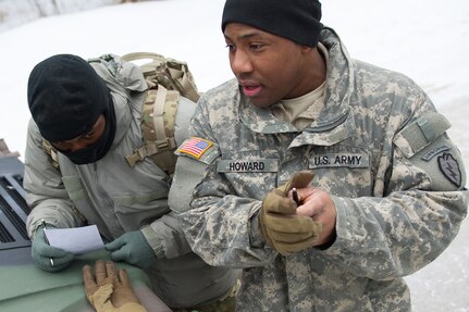 Army Sgt. Gerrald Howard, a native of Atlanta, Ga., assigned to Hawk Company,3rd Battalion, 509th Parachute Infantry Regiment, 4th Infantry Brigade Combat Team (Airborne), 25th Infantry Division, U.S. Army Alaska, talks to Soldiers conducting a land navigation course on Joint Base Elmendorf-Richardson, Alaska, April 4, 2018.  The Soldiers used their skills to plot courses using a lensatic compass, protractor, and a 1:25,000 scale map to navigate to, and locate points using provided grid coordinates within a predetermined time.