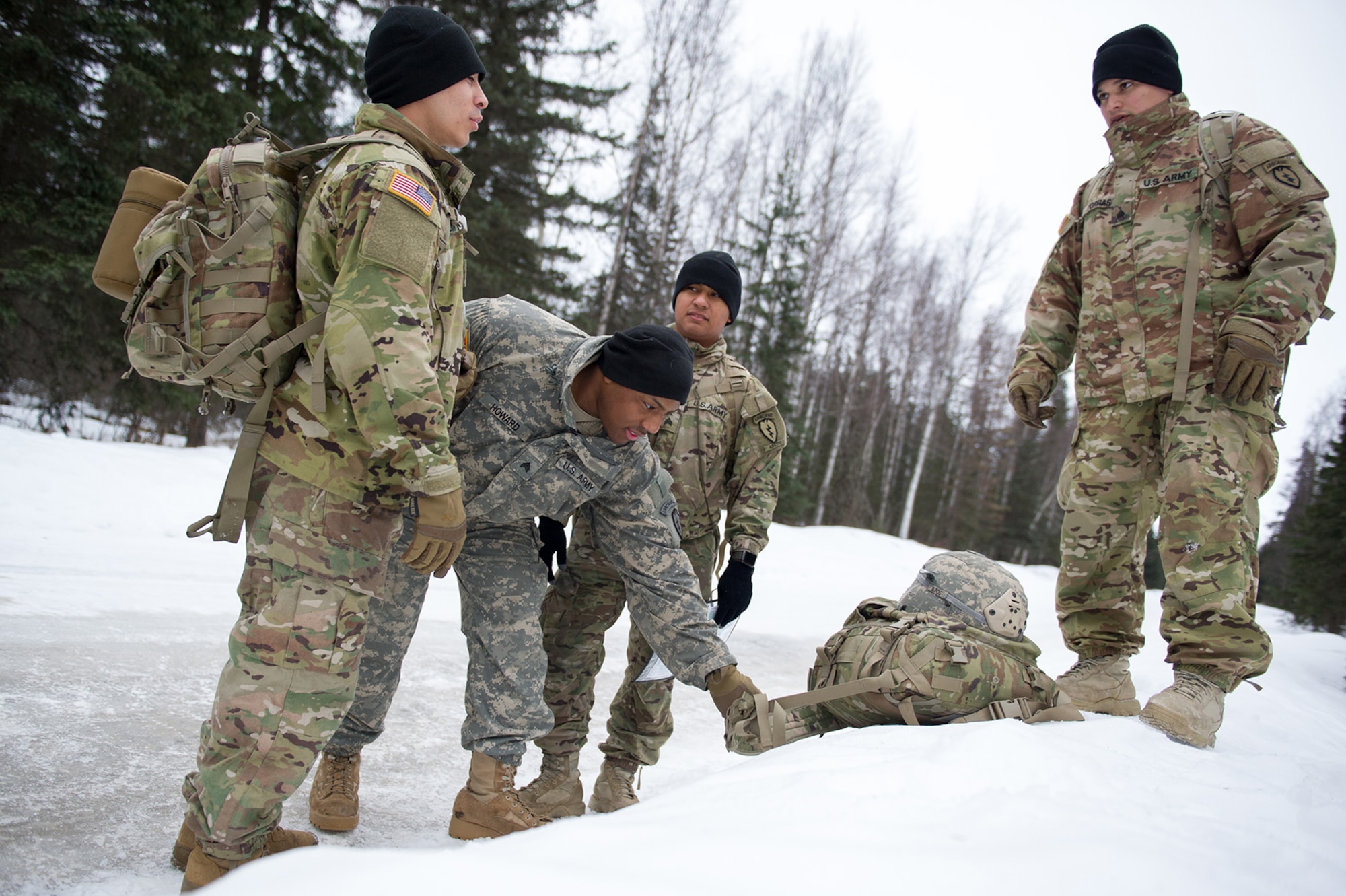 Paratroopers assigned to the 4th Infantry Brigade Combat Team (Airborne), 25th Infantry Division, U.S. Army Alaska, prepare to move out during a land navigation course on Joint Base Elmendorf-Richardson, Alaska, April 4, 2018.  The Soldiers used their skills to plot courses using a lensatic compass, protractor, and a 1:25,000 scale map to navigate to, and locate points using provided grid coordinates within a predetermined time.