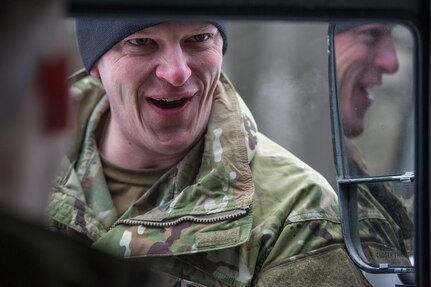 Army Sgt. Aldo Nevarez, a native of San Diego, Calif., assigned to Hawk Company, 4th Infantry Brigade Combat Team (Airborne), 25th Infantry Division, U.S. Army Alaska, listens to a fellow soldier while conducting a land navigation course on Joint Base Elmendorf-Richardson, Alaska, April 4, 2018.  The Soldiers used their skills to plot courses using a lensatic compass, protractor, and a 1:25,000 scale map to navigate to, and locate points using provided grid coordinates within a predetermined time.