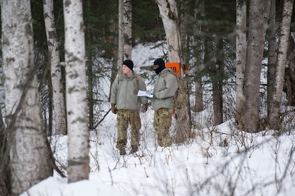 Paratroopers assigned to the 4th Infantry Brigade Combat Team (Airborne), 25th Infantry Division, U.S. Army Alaska, conduct a land navigation course on Joint Base Elmendorf-Richardson, Alaska, April 4, 2018.  The Soldiers used their skills to plot courses using a lensatic compass, protractor, and a 1:25,000 scale map to navigate to, and locate points using provided grid coordinates within a predetermined time.
