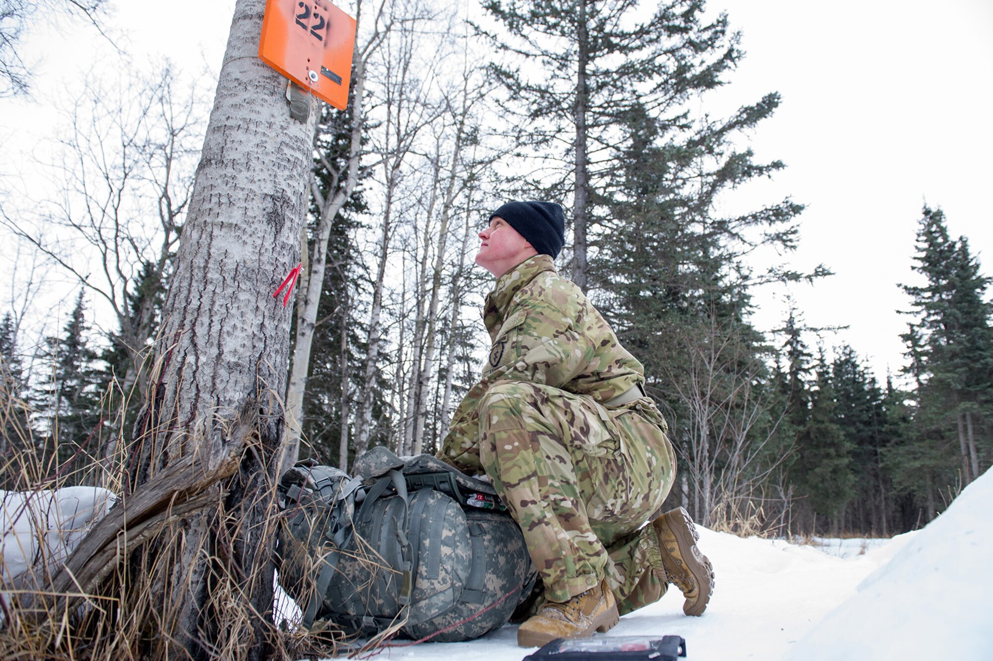 Army 2nd Lt. Brian Morrow, a native of Dahlonega, Ga., assigned to Grindstone Company, 1st Battalion, 501st Parachute Infantry Regiment, 4th Infantry Brigade Combat Team (Airborne), 25th Infantry Division, U.S. Army Alaska, calculates his position during a land navigation course on Joint Base Elmendorf-Richardson, Alaska, April 4, 2018.  Morrow used his skills to plot courses using a lensatic compass, protractor, and a 1:25,000 scale map to navigate to, and locate points using provided grid coordinates within a predetermined time.