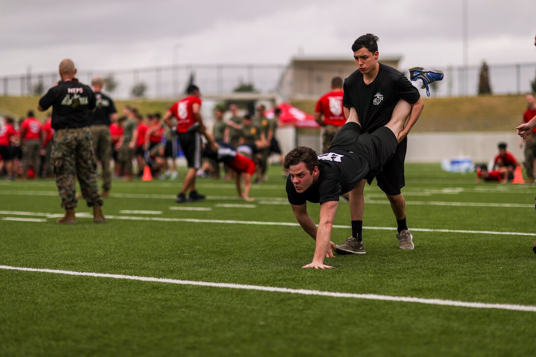 U.S. Marines and poolees with Recruiting Station Houston, conduct an annual pool function at Legacy Stadium, Katy, Texas on Saturday 24, 2018. Pool functions are held to prepare individuals for the physical and mental stress of Marine Corps recruit training.
