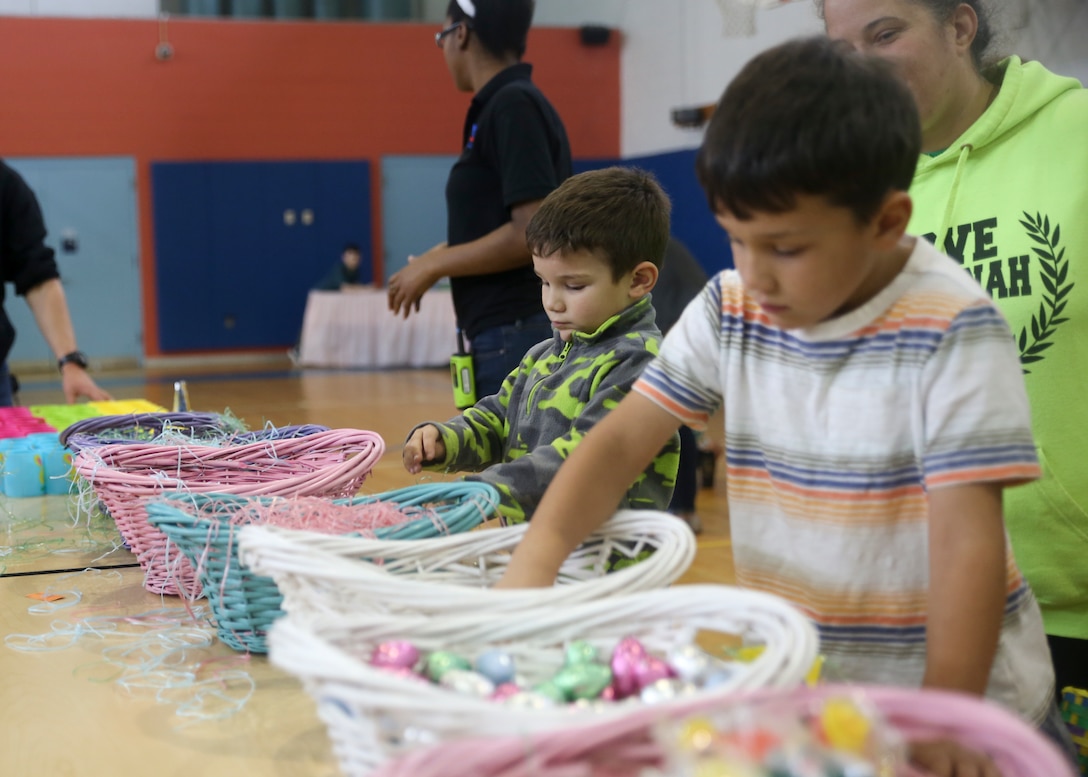 Children participate in making Easter baskets during Laurel Bay Youth Center's annual 'Eggstravaganza' aboard Laurel Bay, March 31st. The family oriented event was held to bring the families of the Tri-command together and celebrate the holiday. The 'Eggstravaganza' offered arts & crafts, bouncy houses as well as an Easter egg hunt.