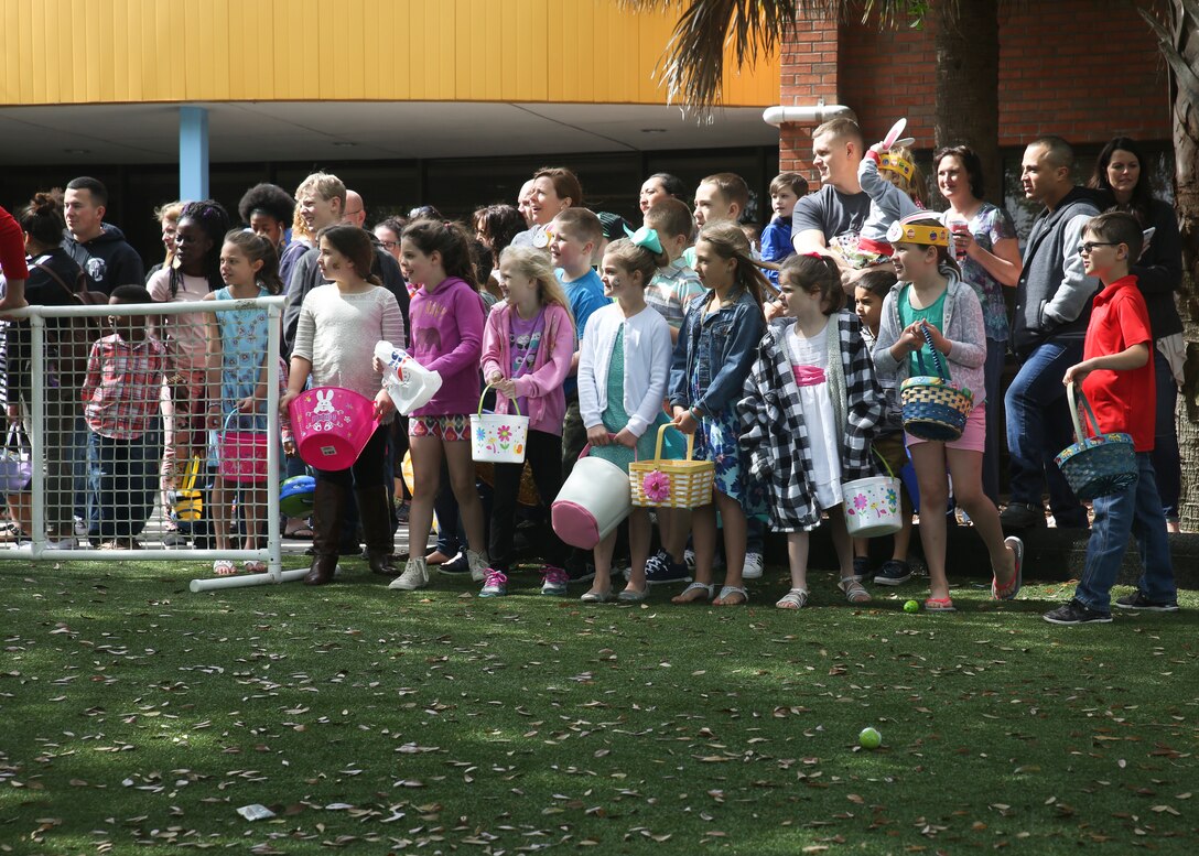 Participants wait for the Easter egg hunt at the Marine Corps Community Service’s annual ‘Eggstravaganza’ aboard Laurel Bay, March 31. The family oriented event was held to bring the families of the Tri-command together and foster unit cohesion. Marines and sailors of the Tri-command volunteered at the event with set-up and clean-up.