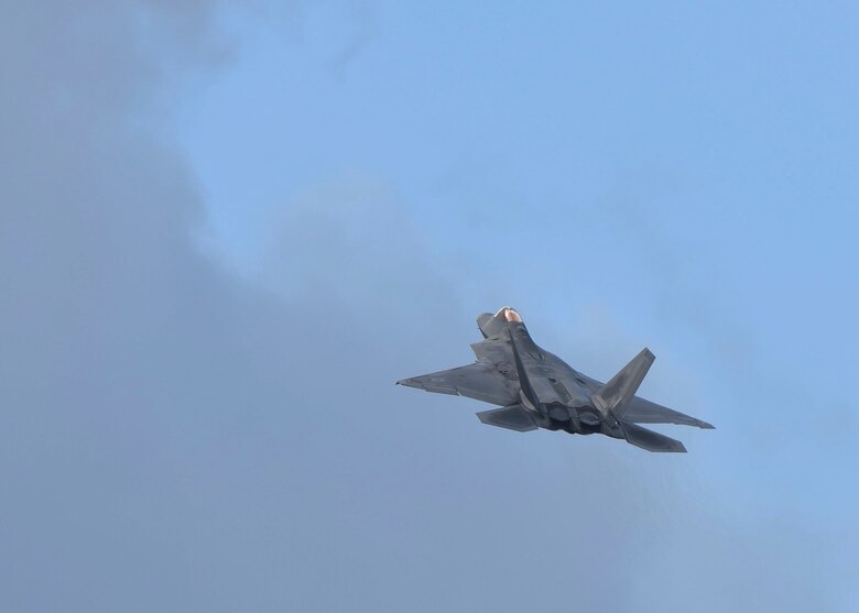 Maj. Paul  Lopez, F-22 Raptor Demonstration Team pilot, highlights the capabilities of the jet during the Los Angeles County Air Show in Lancaster, Calif., March 24, 2018. The team will travel to 21 different locations to perform 25 demonstrations this season. (U.S. Air Force photo by Senior Airman Kaylee Dubois)