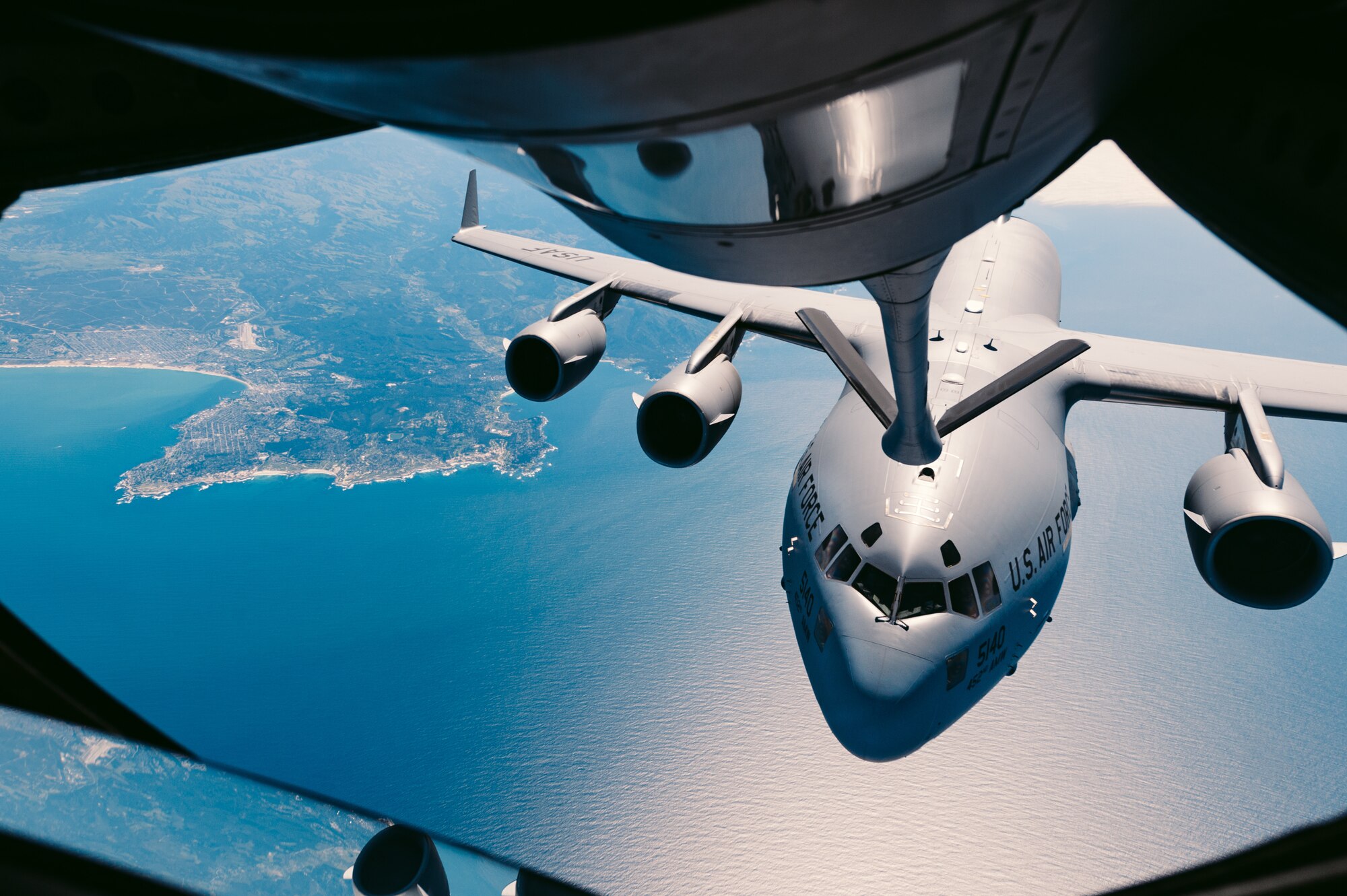 A C-17 Globemaster III approaches to receive fuel from a 336th Aerial Refueling Squadron KC-135 Stratotanker over Calif., March 28, 2018. The 336th ARS is responsible for providing essential mission-extending capabilities through their refueling services. (U.S. Air Force photo by Staff Sgt. Jordan Castelan)