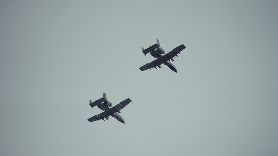 Two A-10C Thunderbolt II's from the 127th Wing, Michigan Air National Guard, conduct a flyover during the funeral service for Tech. Sgt. Dashan Briggs, 106th Rescue Wing special missions aviation specialist, New York Air National Guard, at Calverton National Cemetery, N.Y., March 29, 2018. Briggs was killed when the HH-60G Pave Hawk helicopter he was flying in crashed near the city of Al-Qa�im, Iraq. (U.S. Air National Guard photo by Staff Sgt. Ryan Campbell)