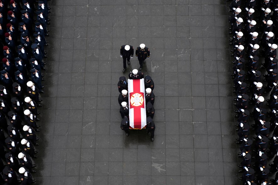 Maj. Christopher Zanetis, 101st Rescue Squadron pilot, 106th Rescue Wing, New York Air National Guard, is honored during a procession led by the Fire Department of New York through lower Manhattan March 29, 2018. Zanetis lost his life close to the Iraq/Syrian border when his aircraft, an HH-60G Pave Hawk helicopter crashed near the city of Al-Qa'im. Zanetis was a member of the New York City Fire Department. (U.S. Air National Guard photo by Christopher Muncy)