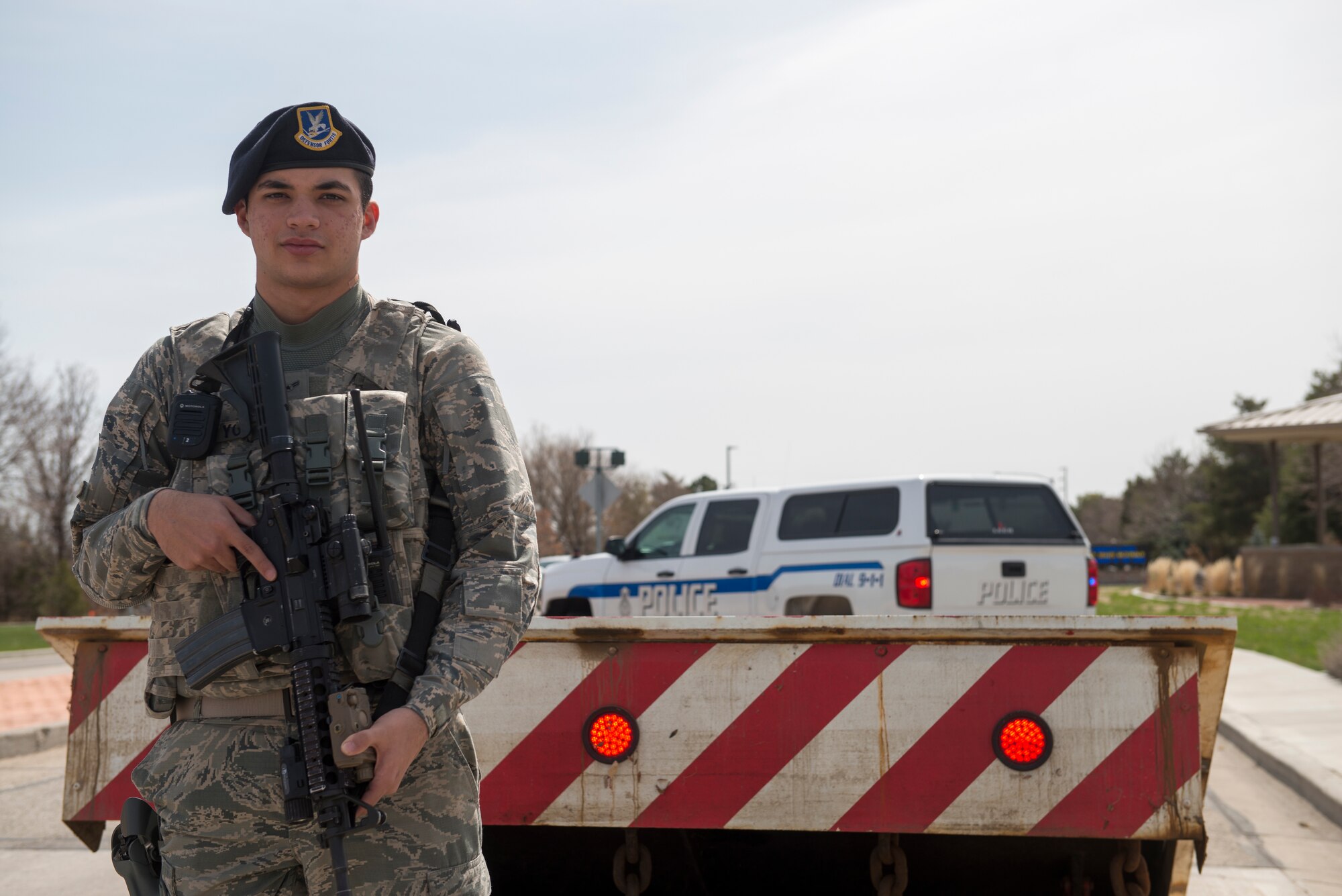 Airman 1st Class Marcus Young, 366th Security Forces Squadron response force member, stands in front of a barrier, April 3, 2018, at Mountain Home Air Force Base, Idaho. The 366th Fighter Wing is constantly evolving installation security measures to stay on guard and prevent incidents from occurring. (U.S. Air Force photo by Airman 1st Class JaNae Capuno)