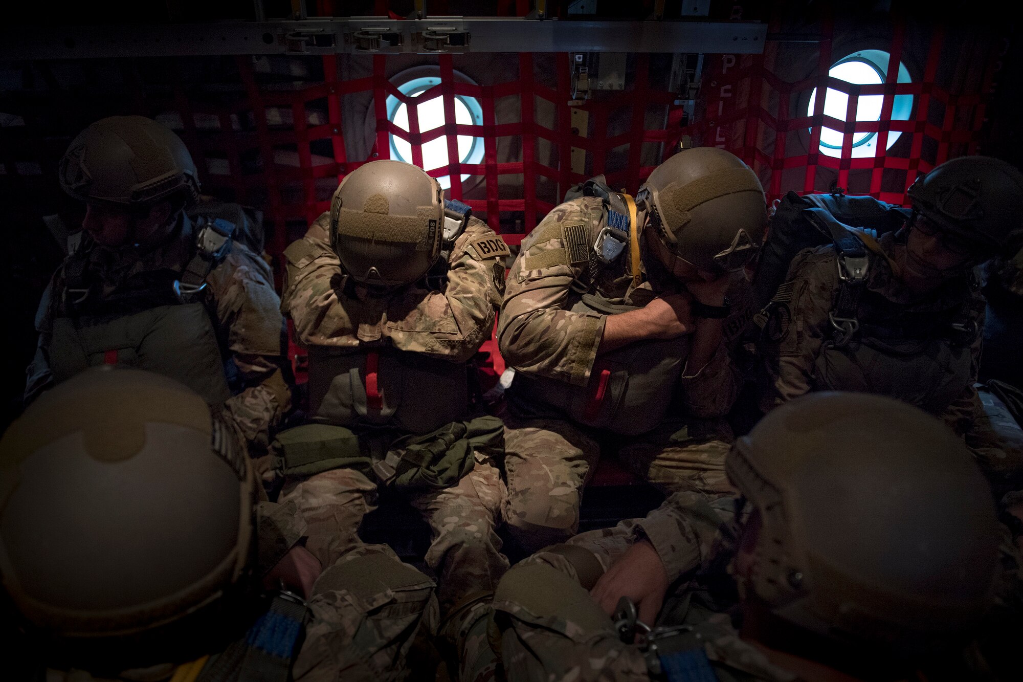 Airmen from the 820th Base Defense Group wait in the rear of an HC-130J Combat King II prior to conducting static-line jumps, March 30, 2018, in the skies over Moody Air Force Base, Ga. The 820th BDG and the 71st RQS work together frequently so the defenders and the aircrew can maintain their qualifications. (U.S. Air Force photo by Staff Sgt. Ryan Callaghan)