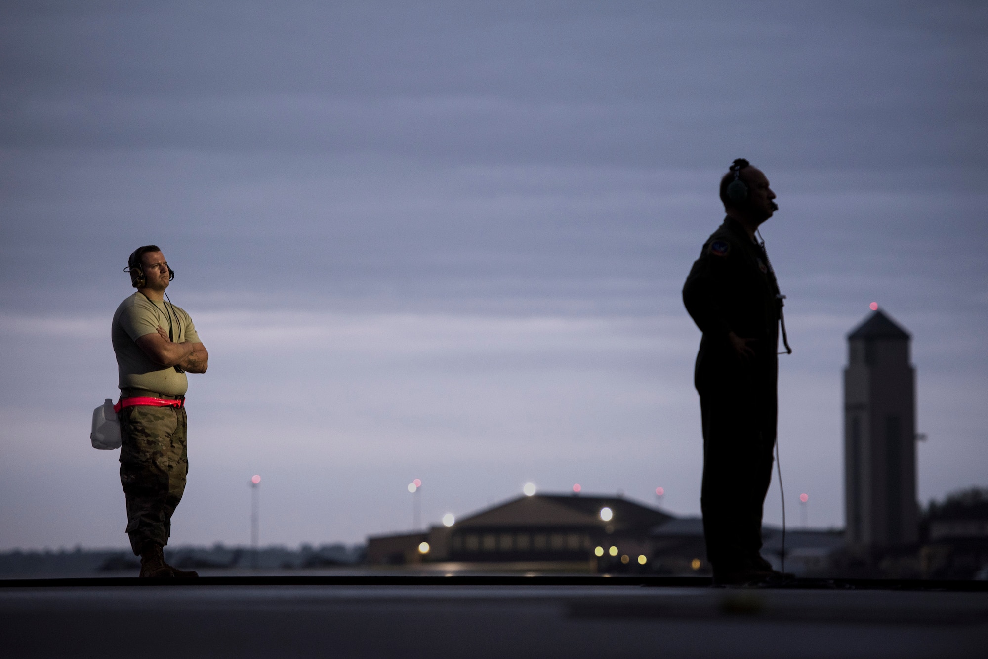 A maintainer from the 71st Aircraft Maintenance Unit, left, watches as aircrew from the 71st Rescue Squadron prepare for a flight, March 30, 2018, at Moody Air Force Base, Ga. Maintenance and aircrew members have to work closely together prior to each sortie to ensure the plane is ready to fly and departs safely. (U.S. Air Force photo by Staff Sgt. Ryan Callaghan)