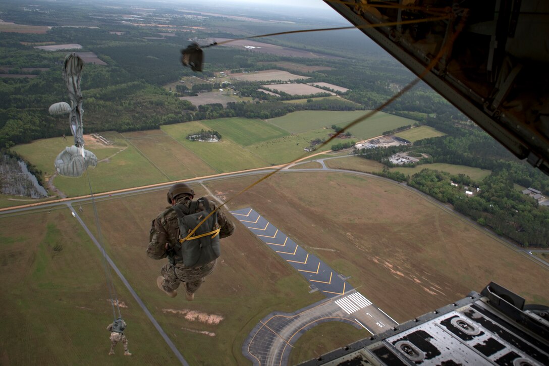 Airmen from the 820th Base Defense Group jump from an HC-130J Combat King II during static-line jump proficiency training, March 30, 2018, in the skies over Moody Air Force Base, Ga. The 820th BDG and the 71st RQS work together frequently so the defenders and the aircrew can maintain their qualifications. (U.S. Air Force photo by Staff Sgt. Ryan Callaghan)