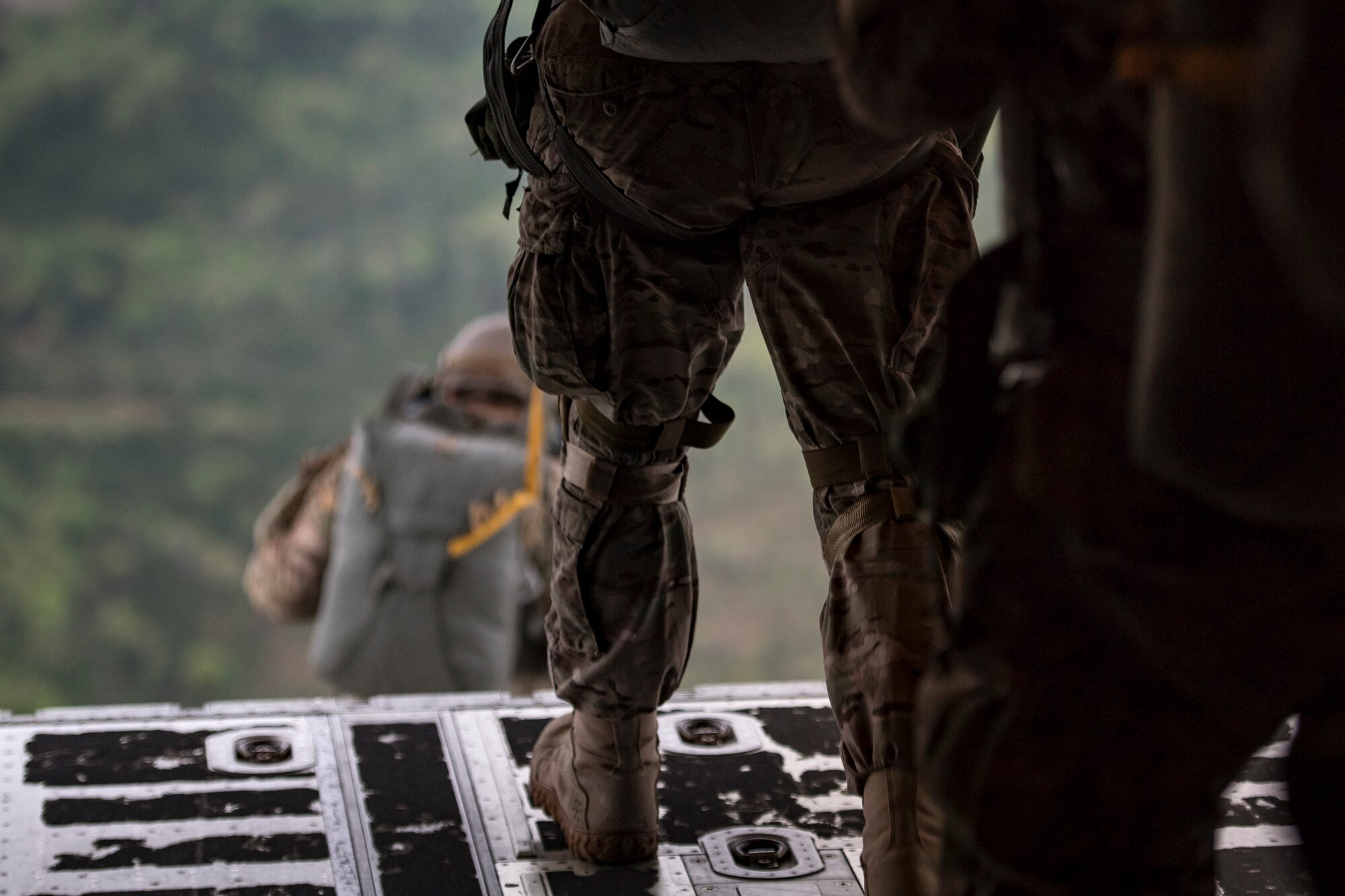 Airmen from the 820th Base Defense Group jump from an HC-130J Combat King II during static-line jump proficiency training, March 30, 2018, in the skies over Moody Air Force Base, Ga. The 820th BDG and the 71st RQS work together frequently so the defenders and the aircrew can maintain their qualifications. (U.S. Air Force photo by Staff Sgt. Ryan Callaghan)