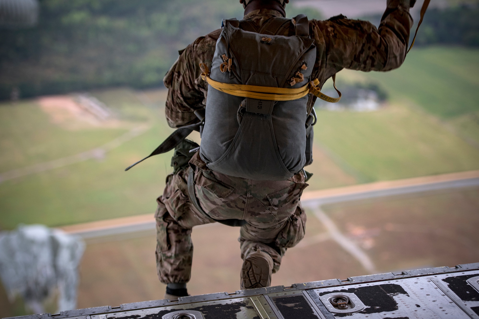 An Airman from the 820th Base Defense Group jump from an HC-130J Combat King II during static-line jump proficiency training, March 30, 2018, in the skies over Moody Air Force Base, Ga. The 820th BDG and the 71st RQS work together frequently so the defenders and the aircrew can maintain their qualifications. (U.S. Air Force photo by Staff Sgt. Ryan Callaghan)