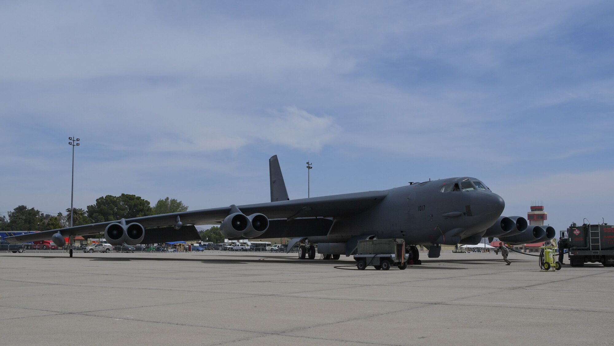 A U.S. Air Force Airman assigned to the 452nd Air Refueling Wing pulls a hose from a fuel truck to the belly of a B-52 Stratofortress at March Air Reserve Base, California April 5, 2018.