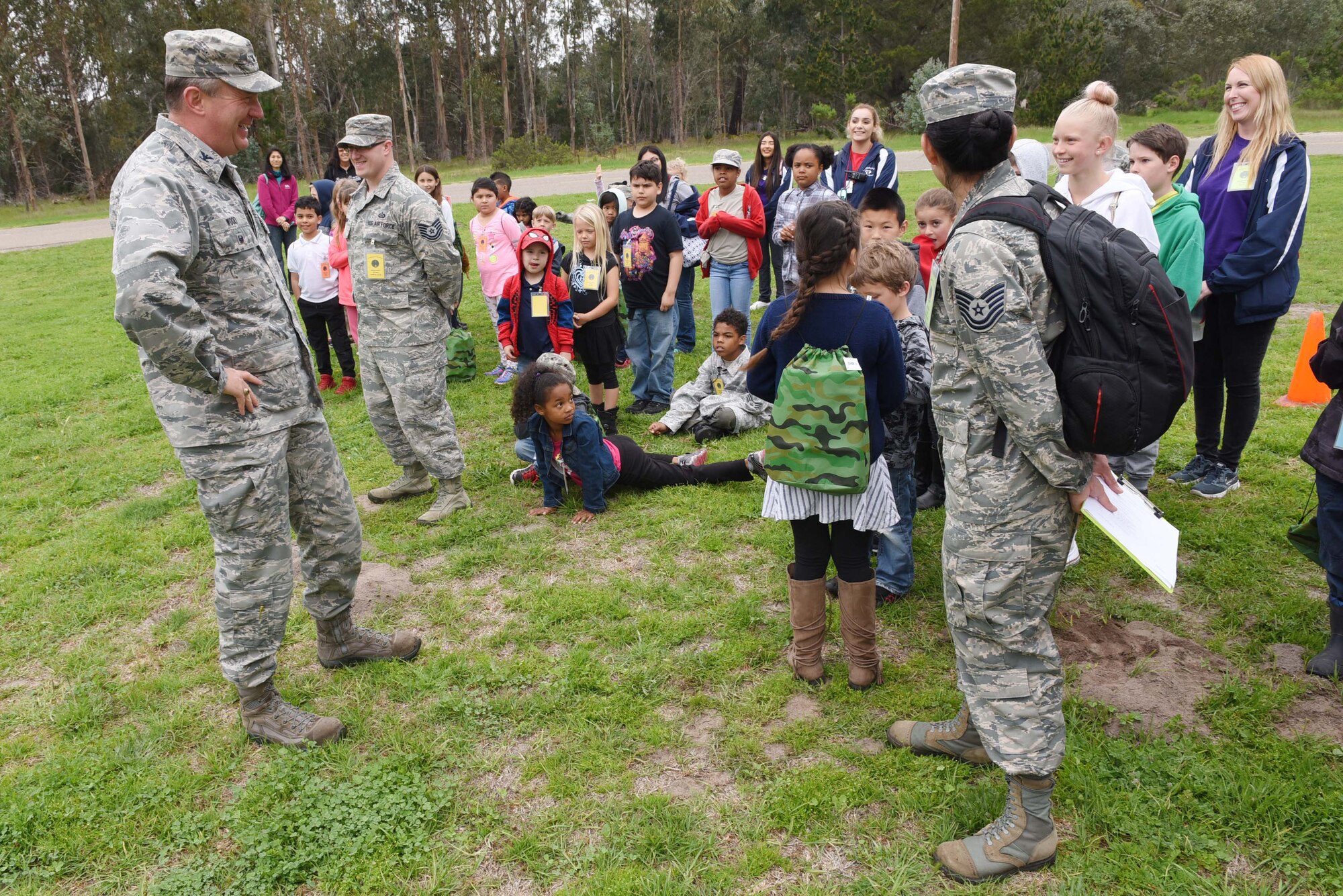 Col. Gregory Wood, 30th Space Wing vice commander, briefs children during Kids Understanding Deployment Operations, April 4, 2018, Vandenberg Air Force Base, Calif. KUDOS is a program developed to give children a deeper understanding of the military deployment process and equipment utilized during a deployment. (U.S. Air Force photo by Tech. Sgt. Jim Araos/Released)